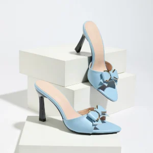 Light blue pointed high-heeled mules with bows