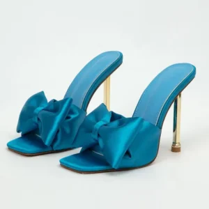 Teal satin mules with gold stiletto heels