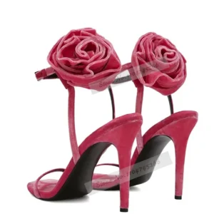 Pink rose-embellished suede high-heeled sandals