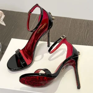 Black patent stiletto sandals with red lining