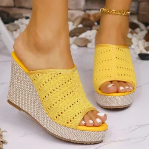 Yellow knit wedge sandals with white pedicure
