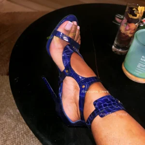 Close-up of feet in blue high-heeled sandals