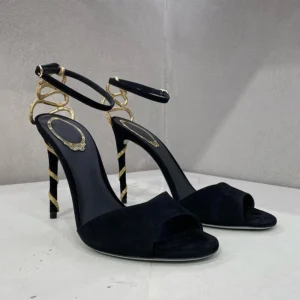 Black suede stiletto sandals with gold chains