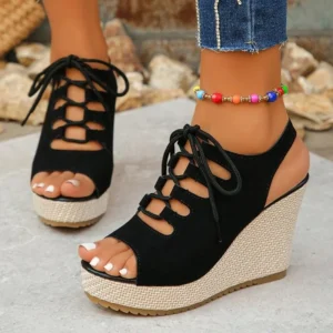 Black lace-up wedge sandals with colorful anklet