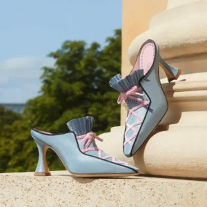 Light blue heeled mules with pink laces