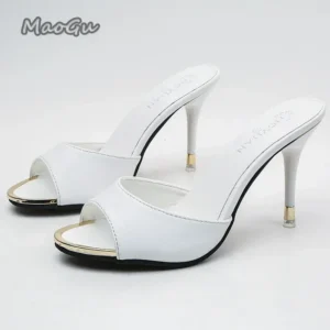 Pair of white open-toe high-heeled mules