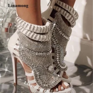 White strappy high heels with crystal embellishments
