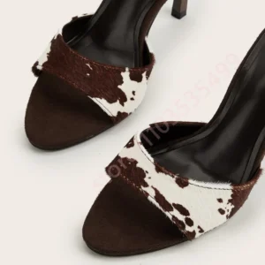 Brown cowhide open-toe heeled sandals close-up