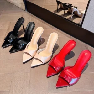 Black, white, and red pointed-toe mule heels