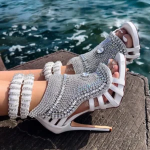 Rhinestone encrusted white high heels with anklets