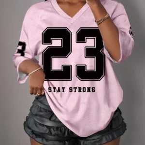Pink jersey with number 23 and "Stay Strong