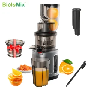 Cold press juicer with oranges and accessories