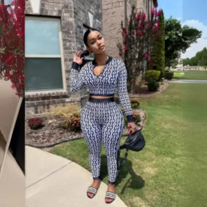 Woman in black-and-white patterned two-piece outfit
