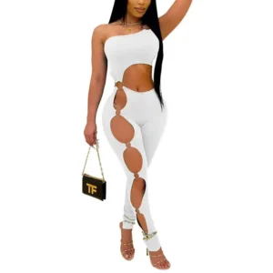 Woman in white jumpsuit with circular cutouts