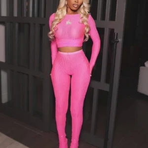 Woman in pink ribbed two-piece outfit
