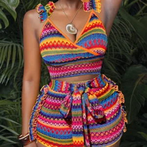 Woman in colorful patterned crop top and shorts