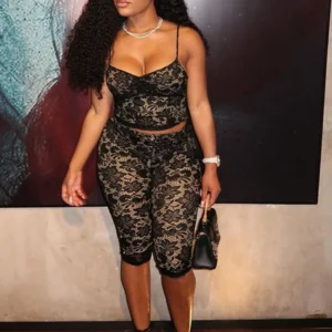 Woman in black lace crop top and pants